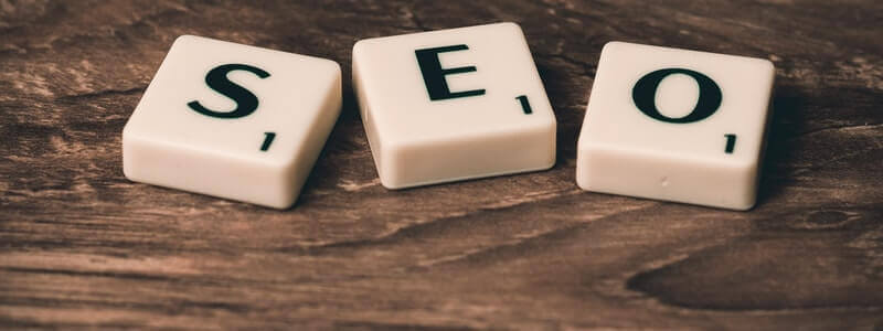 Three scrabble squares placed in line, making the word SEO.