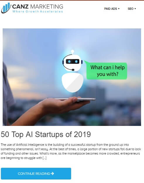 A screenshot of a blog from Canz Marketing blog section titled *50 Top AI Startups of 2019* with a hand holding a cellphone. A robotic figure is shown over the cell phone, appearing to ask *What can I help you with?*